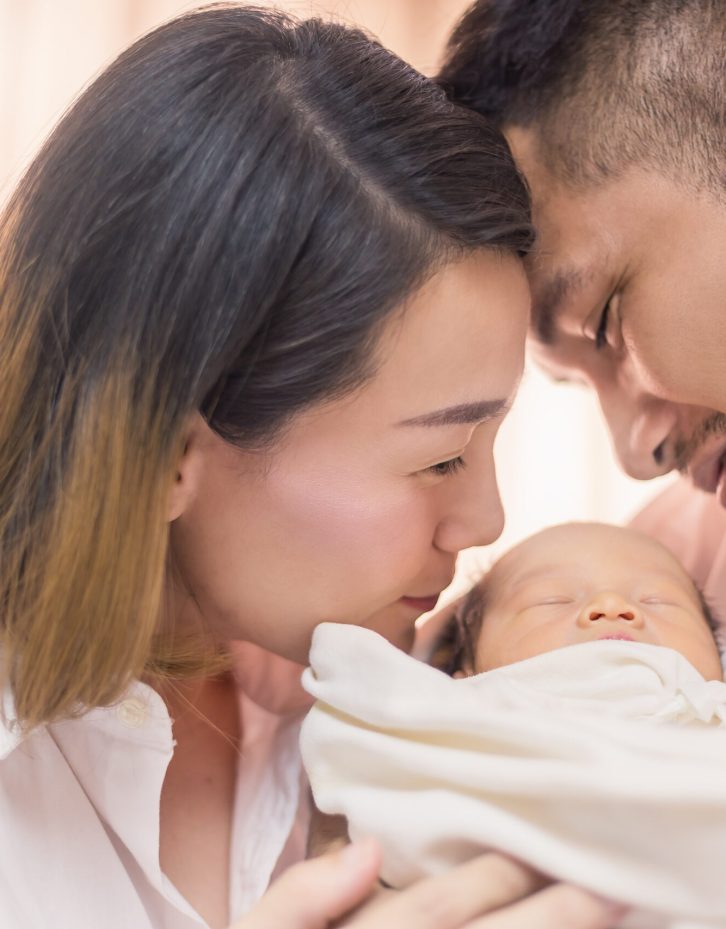Asian parents newborn baby, Close up portrait of asian young couple father mother holding kissing their new born baby in hospital bed. Happy family love newborn nursery mother’s day holiday concept Asian parents with newborn baby, Close up portrait of asian young couple father mother holding kissing their new born baby in hospital bed. Happy family love newborn nursery mother’s day holiday concept